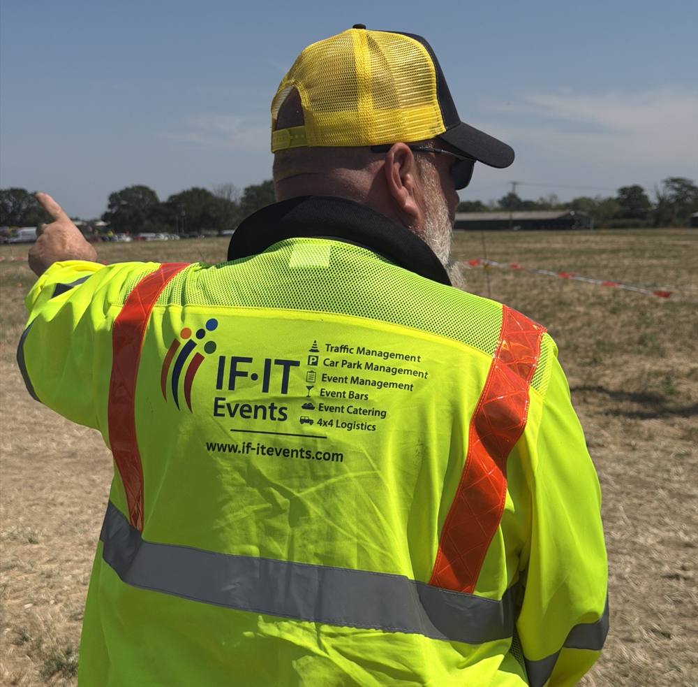 IF IT Events staff member in branded hi-vis jacket directing on site
