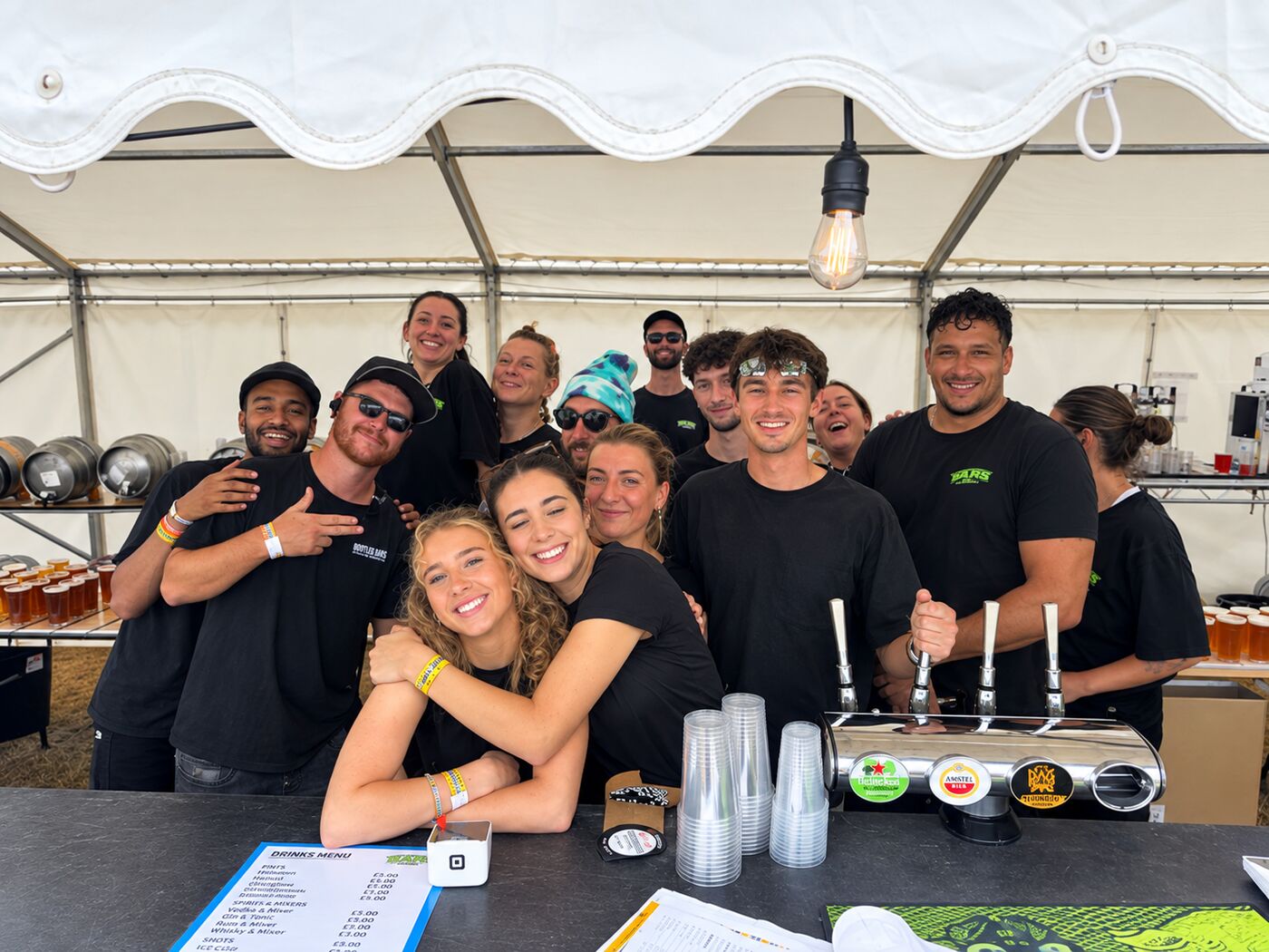 IF IT Events bar team behind a festival bar