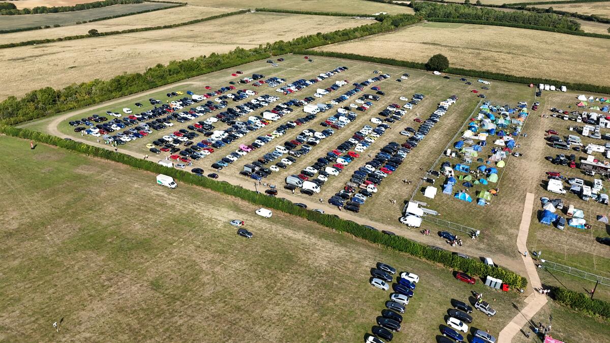 Aerial drone view of an event car park and campsite